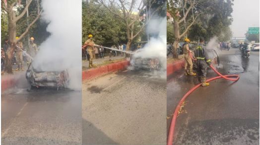 नोएडा में सड़क पर दौड़ रही कार में उठा आग का गुबार, चालक ने कूदकर बचाई जान